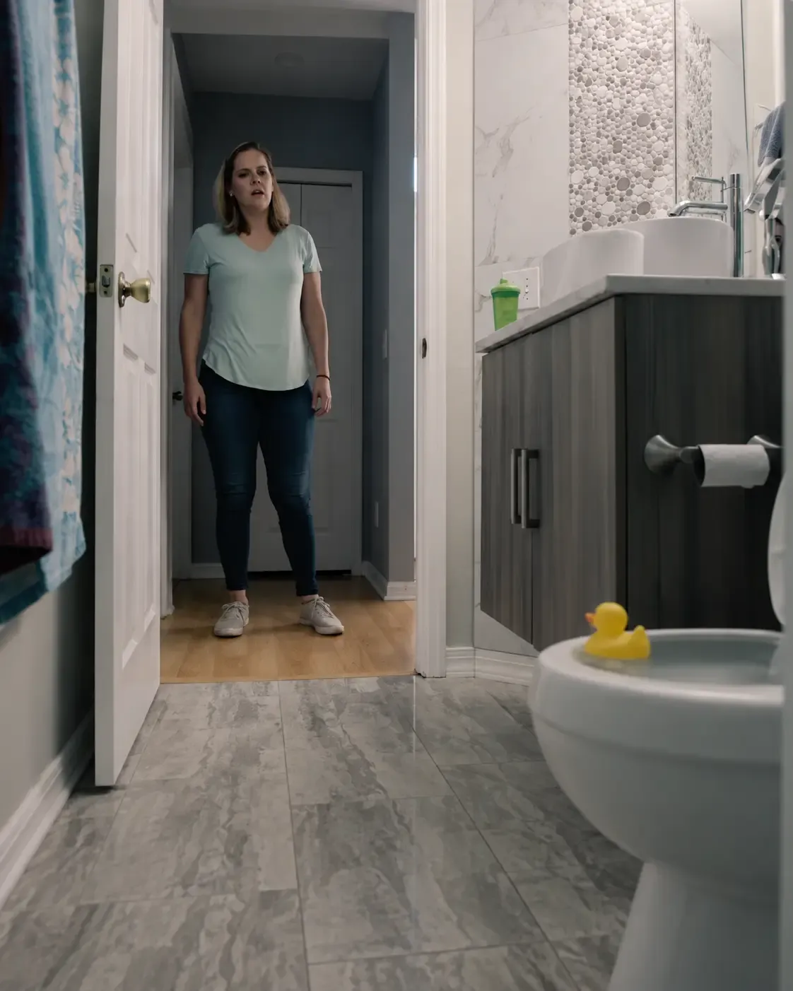 Behind the scenes of a FlyPoint concept commercial shoot featuring an actor in a bathroom doorway.